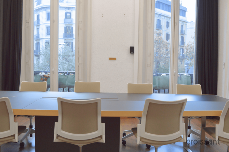 a dining room table in front of a window