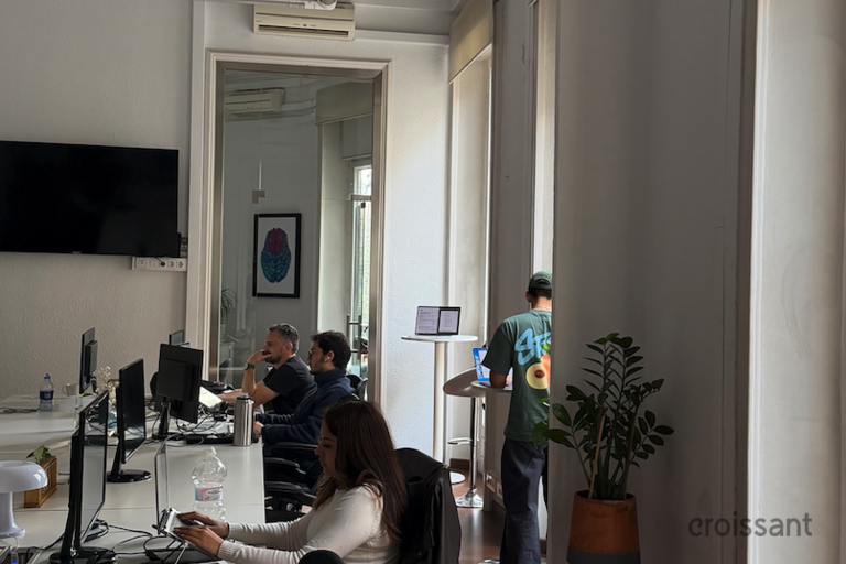 a living room filled with furniture and a large window