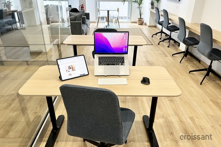 a desk with a chair in a room