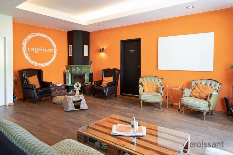 a living room filled with furniture and a fire place
