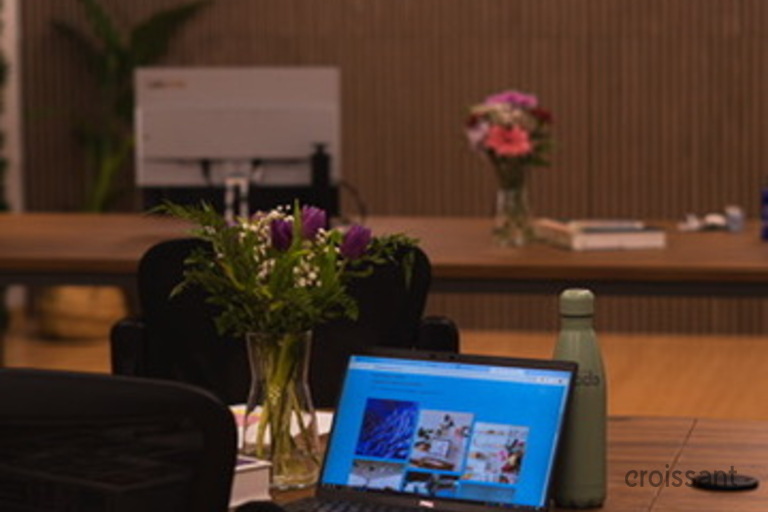 a person sitting at a table in a room
