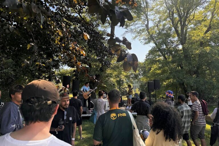 a group of people standing in front of a crowd