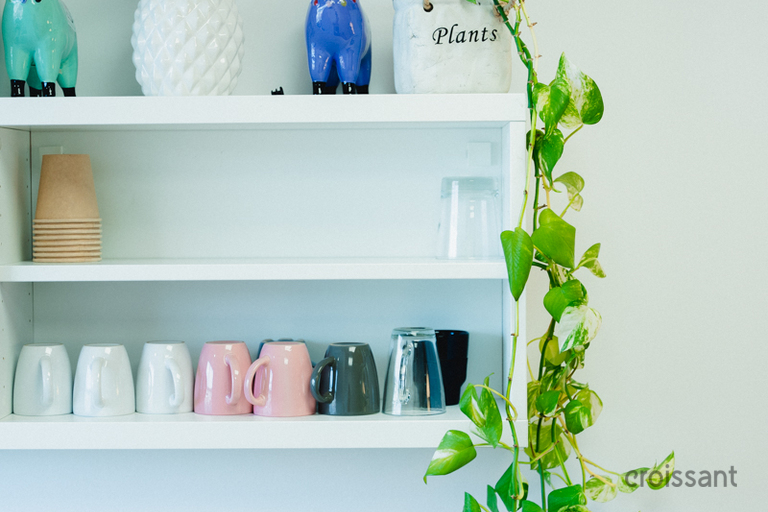 a vase of flowers on a shelf