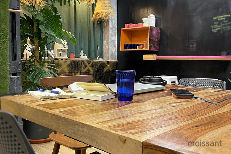 a desk with a laptop on a table