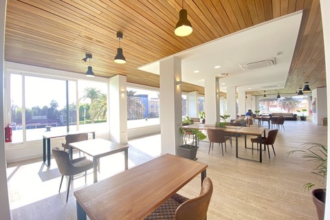 a room filled with furniture and a large window