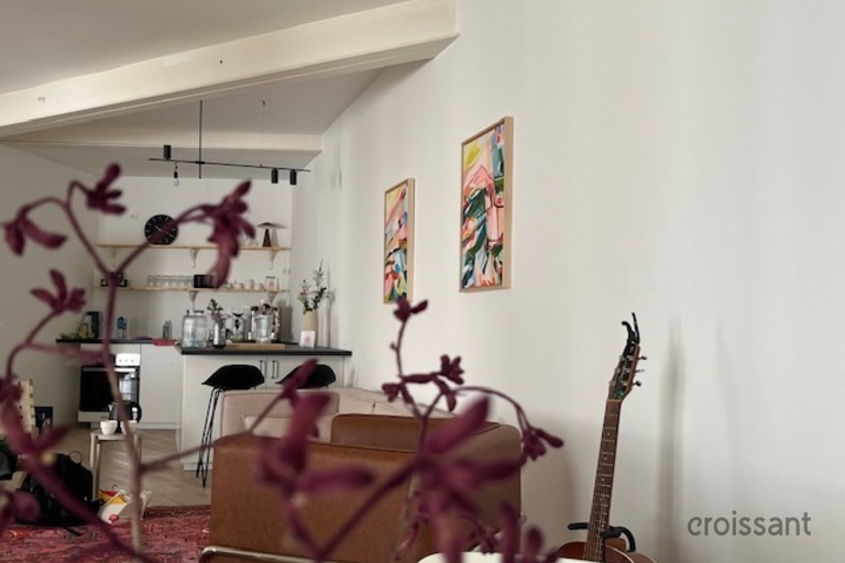 a room filled with furniture and a mirror