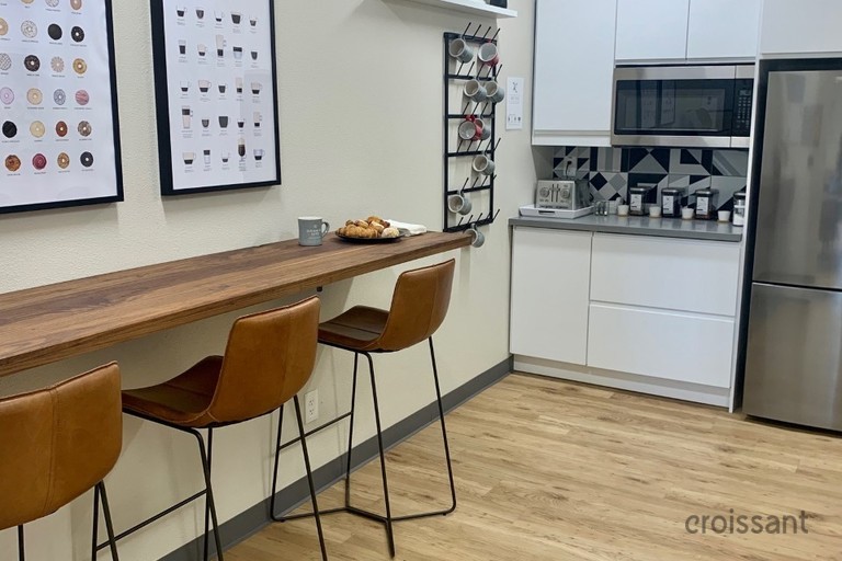 a kitchen with a table in a room