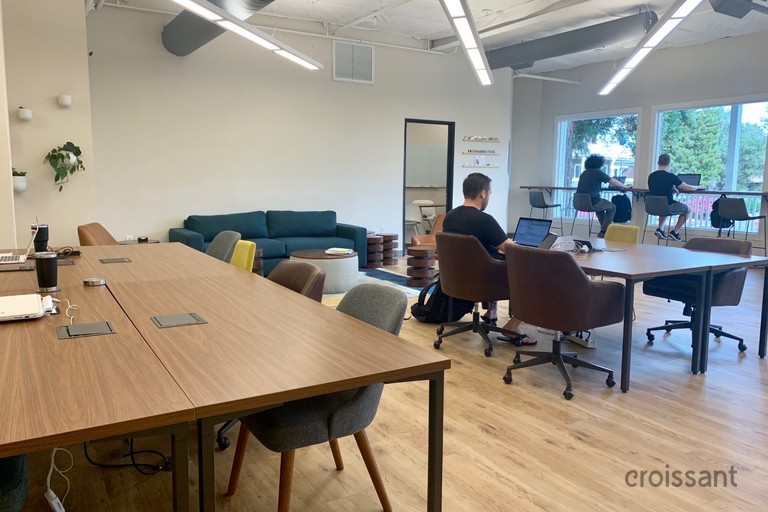 a group of people sitting at a table in a room