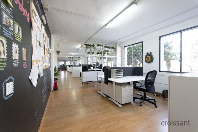 a room filled with furniture and a large window