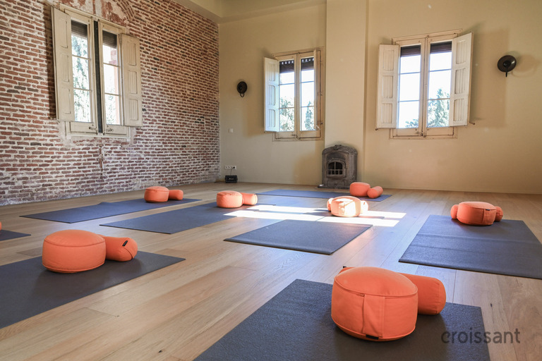 a living room filled with furniture and a large window