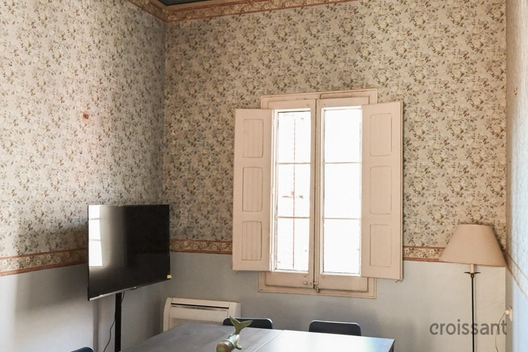 a room with a table and chairs