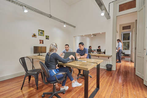 a person sitting at a table in a room