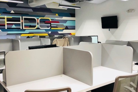 an office with a desk and chair in a room