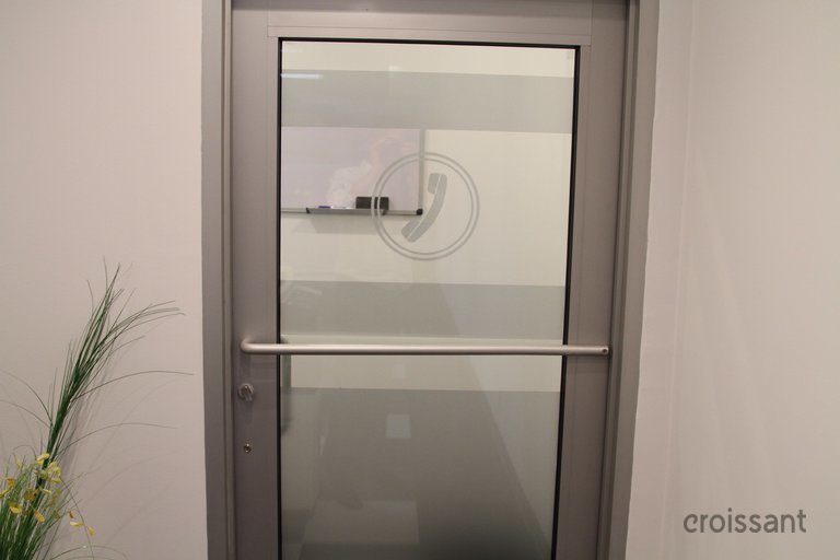 a white refrigerator freezer sitting next to a door