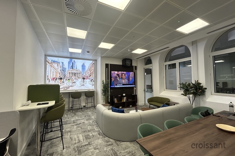 a living room filled with furniture and a large window