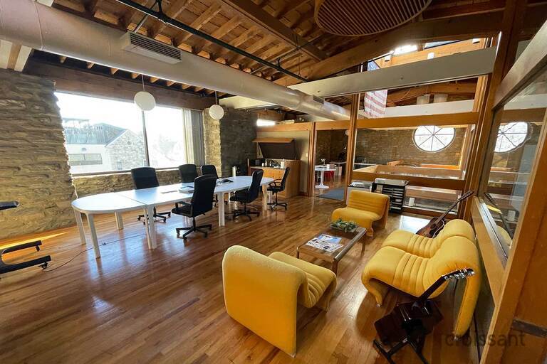 a room filled with furniture next to a building