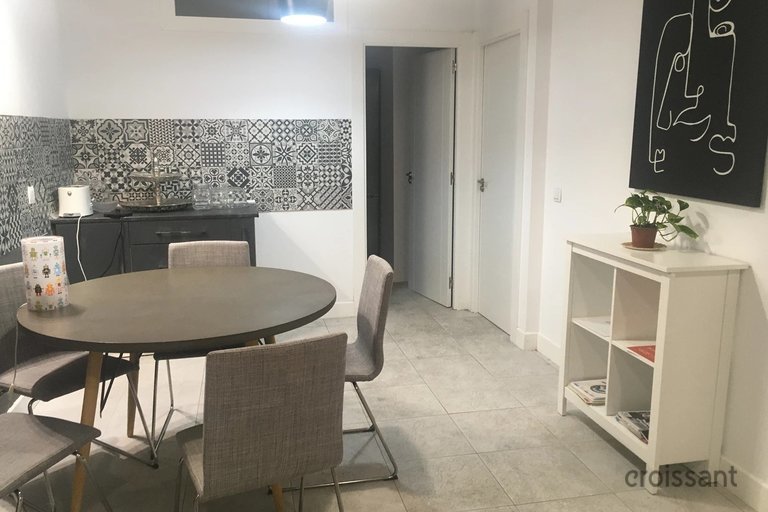 a desk with a chair in a room