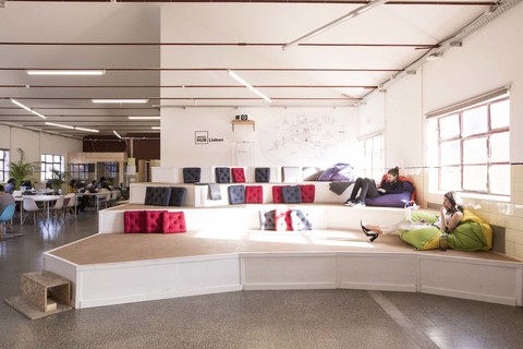 a room filled with furniture and a large window