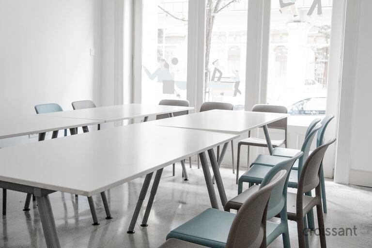a dining room table in front of a window