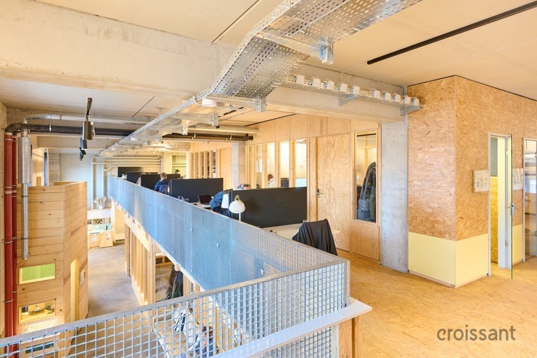 a kitchen with a blue chair