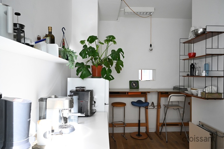 a kitchen with a table in a room