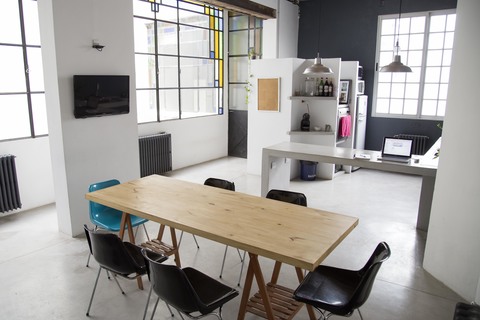 a desk with a chair in a room