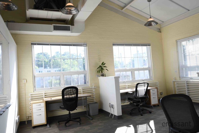 a room filled with furniture and a large window