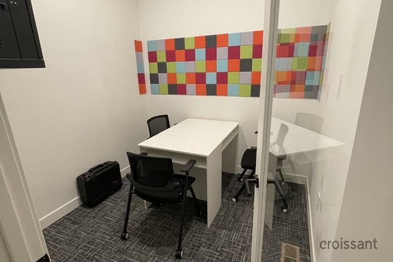 a bedroom with a bed in a room