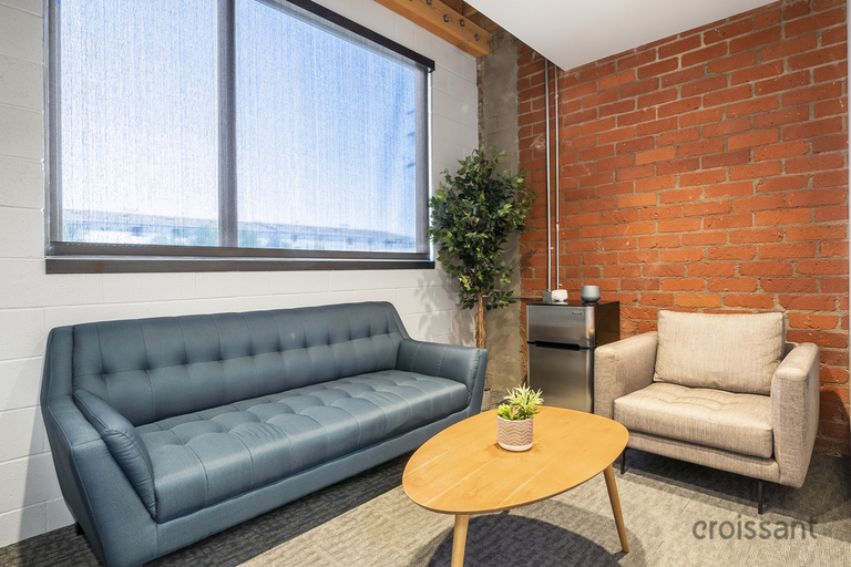 a brown leather couch in a living room