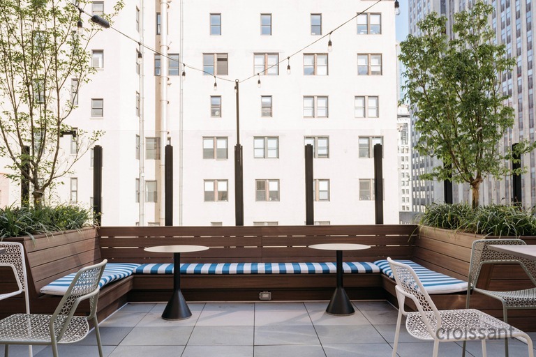 a chair sitting in front of a building