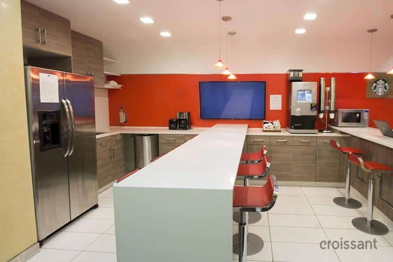 a kitchen with a table in a room