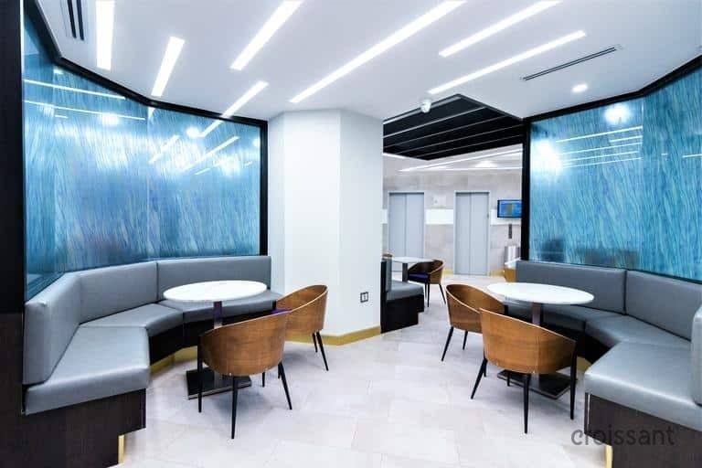 a living room filled with furniture and a large window