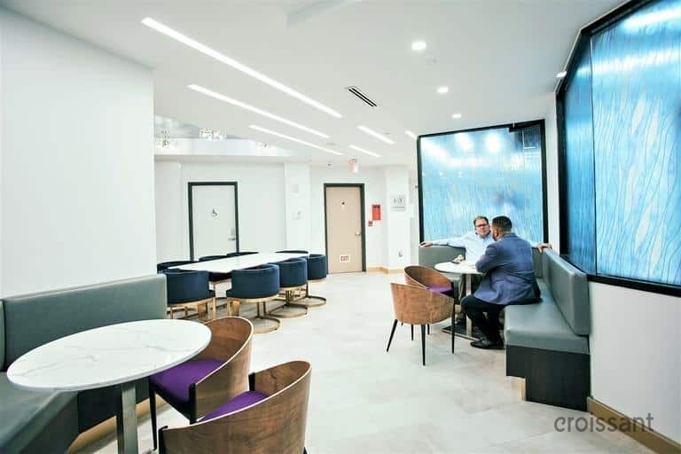 a room filled with furniture and a large window