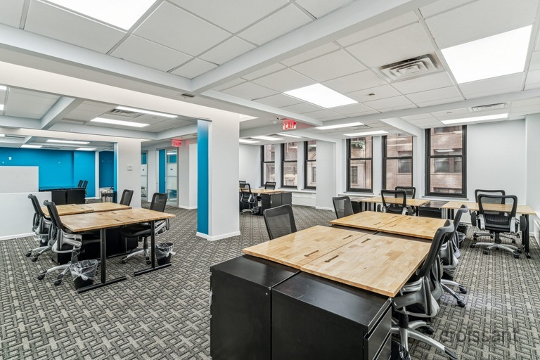 a room filled with furniture and a table in front of a building