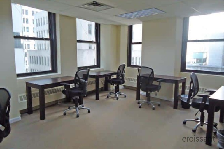 a room filled with furniture and a large window