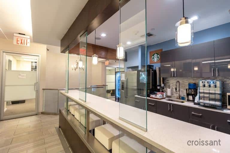 a large commercial kitchen with stainless steel appliances