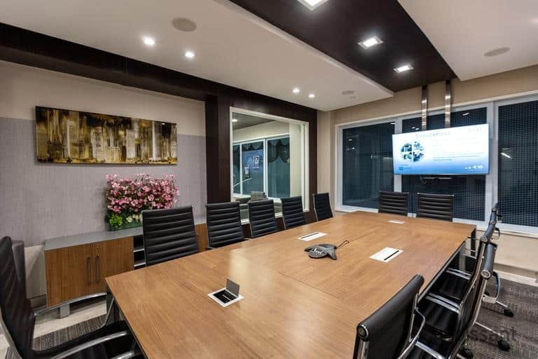 a room filled with furniture and a flat screen tv