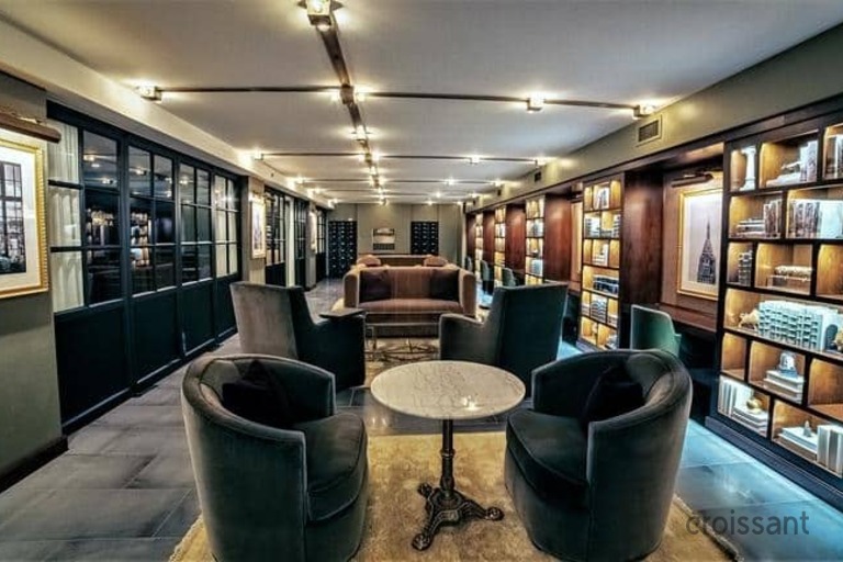 a room filled with furniture and a large window