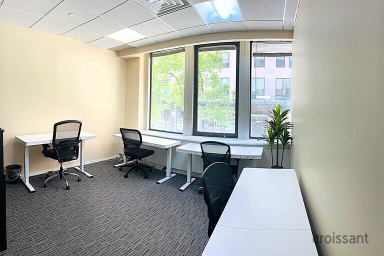 a living room filled with furniture and a large window