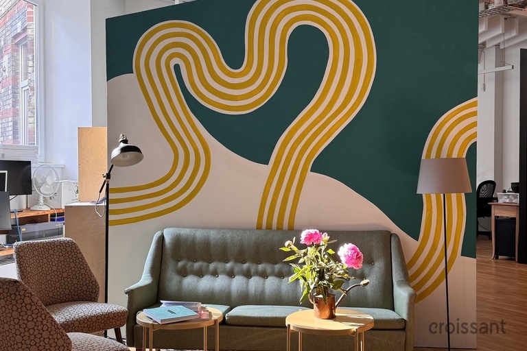 a living room filled with furniture and decor