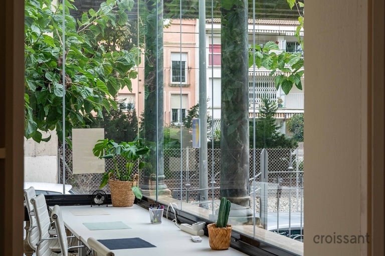 a dining room table in front of a window