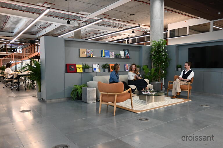 a room filled with furniture next to a building
