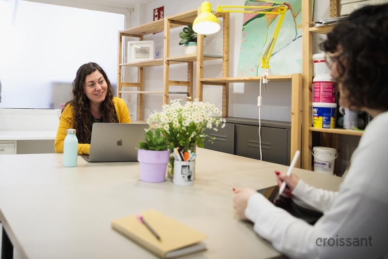 a woman sitting at a table