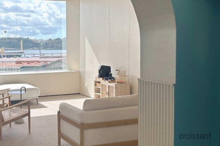 a room filled with furniture and a large window