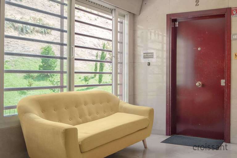 a living room filled with furniture and a fireplace