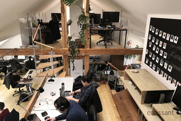 a person sitting at a desk in a room