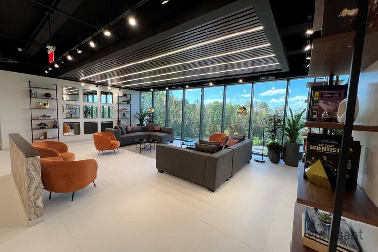 a room filled with furniture and a large window