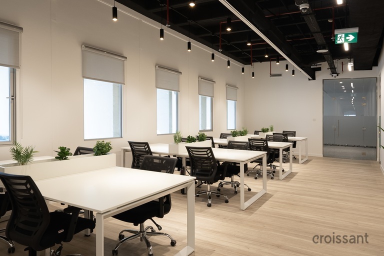 a room filled with furniture and a large window