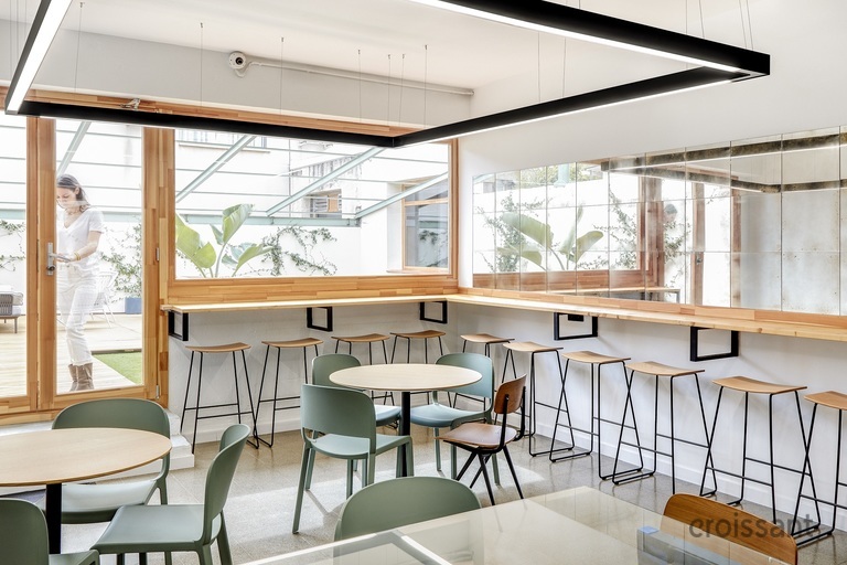 a dining room table in front of a window