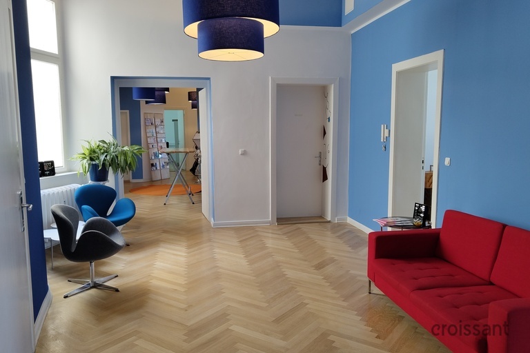 a room with a bed and a mirror